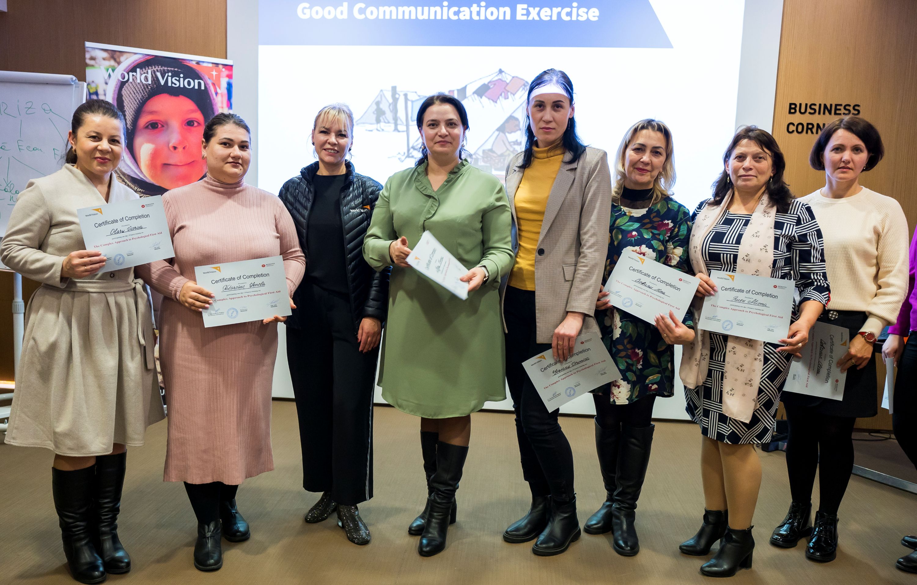 A group of teachers and psychologists receive their training certificates in Moldova