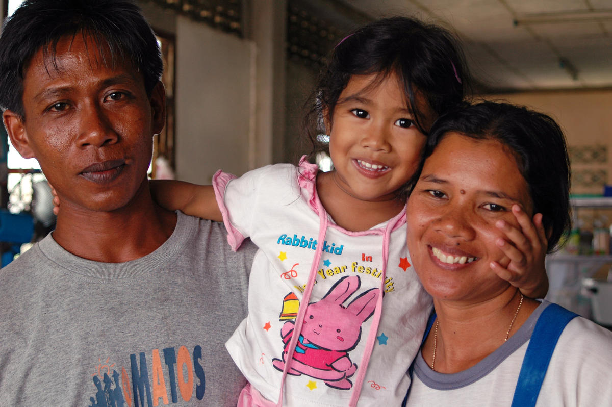 Mother, Father and Daughter smile in Thailand