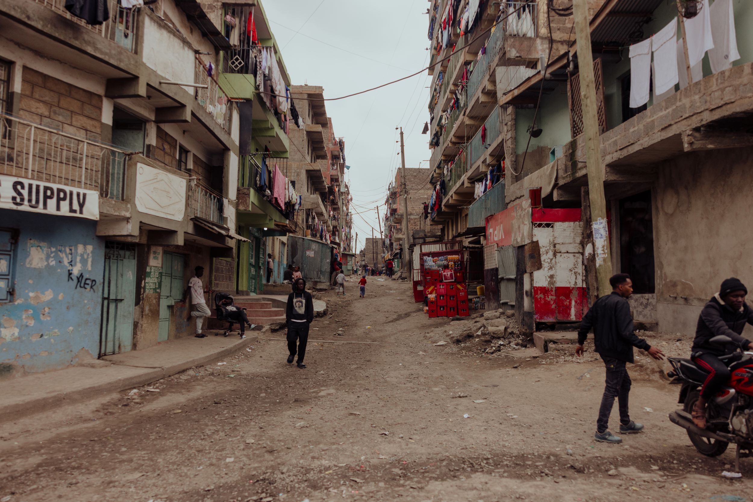 Street in urban Kenya with towering buildings