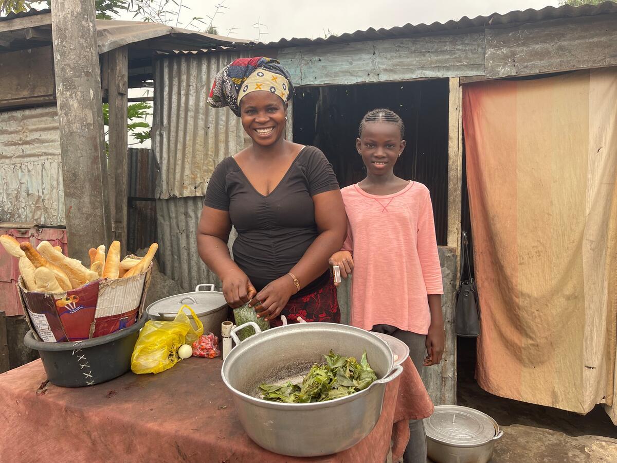 Belensi and her 10-year-old daughter Benie, a sponsored child, are overjoyed with their new income-generating activity, made possible by World Vision's Saving Group approach.