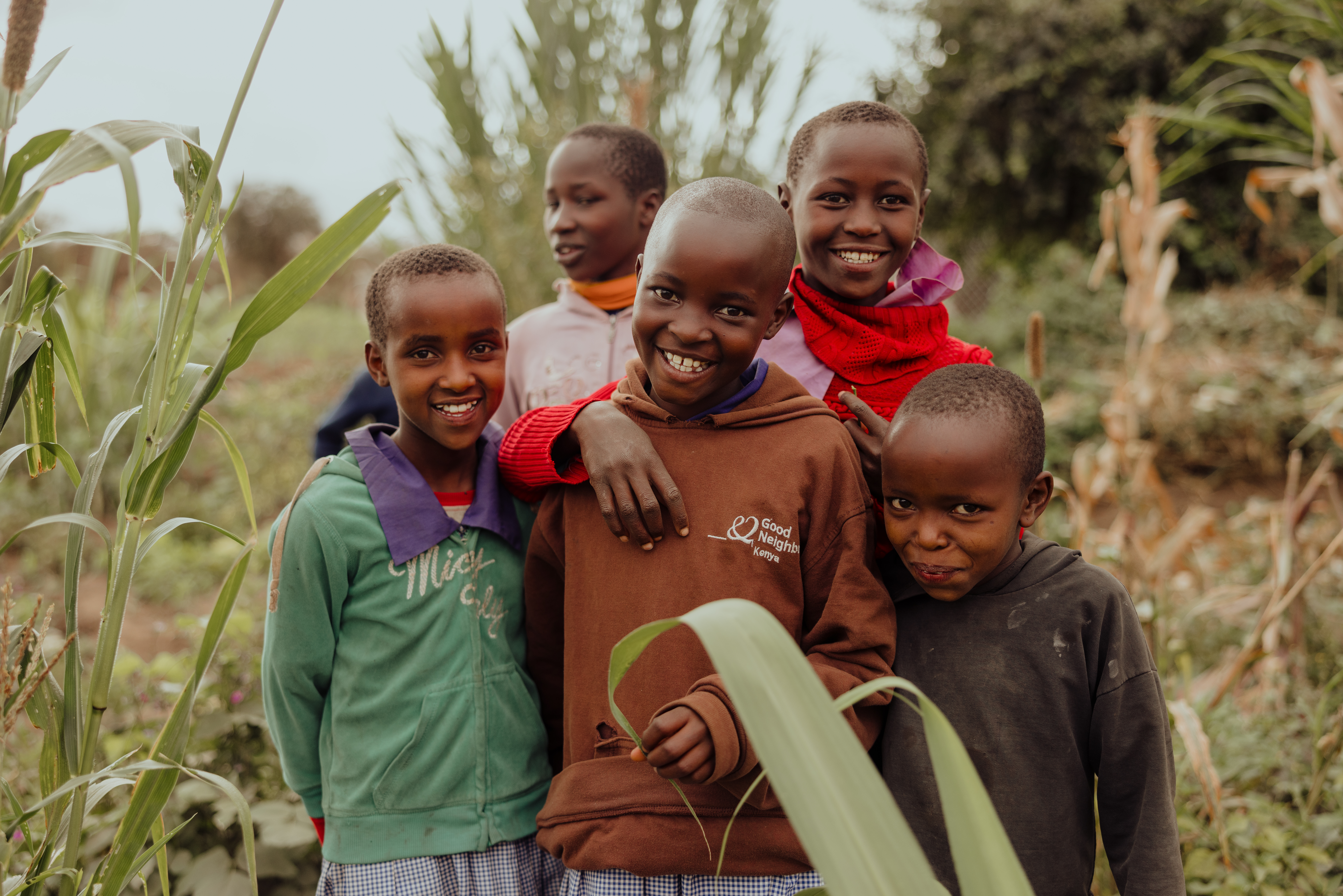 Smiling children stood together in rural Kenya