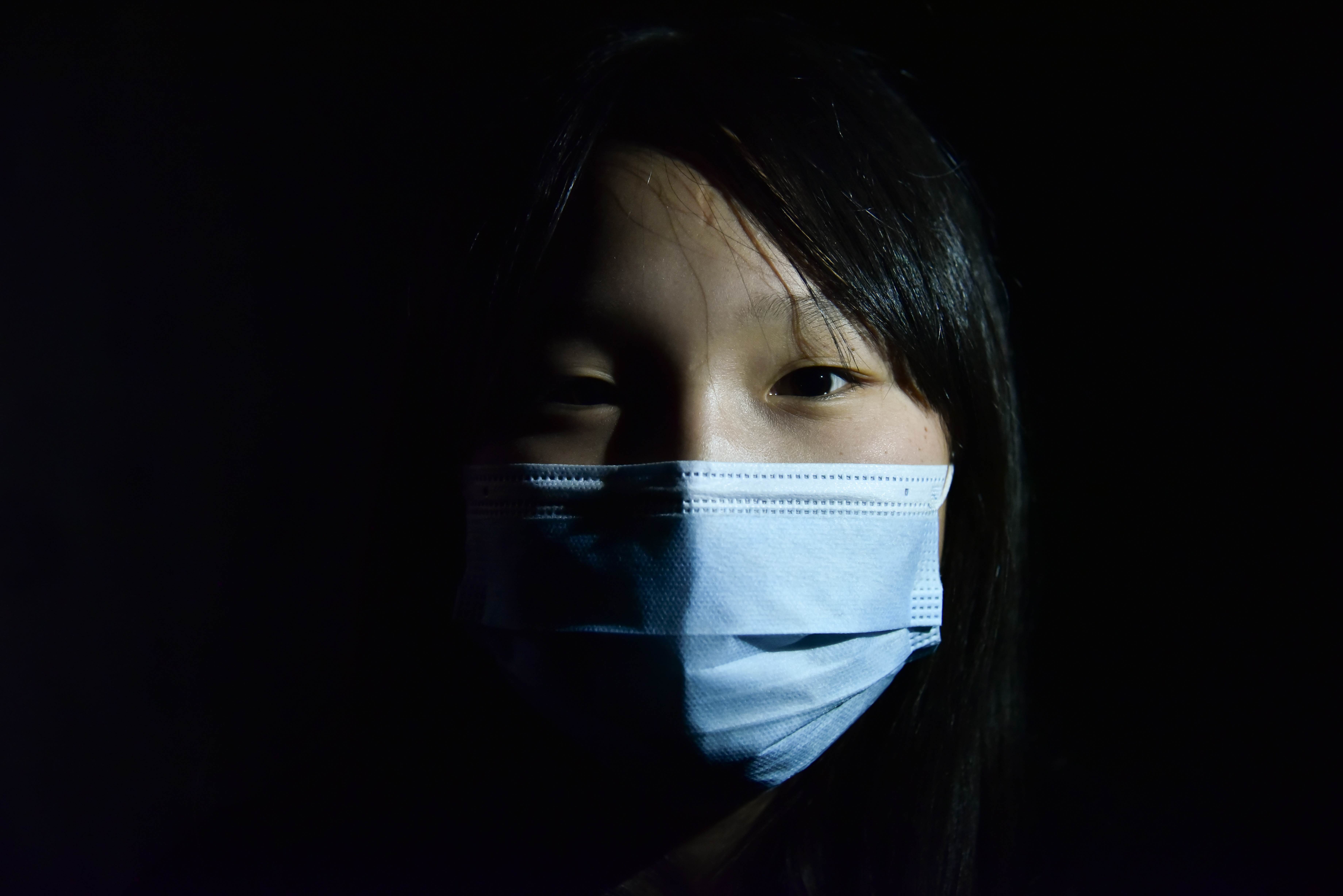 Enkhjin,12, in Mongolia wears a face mask to protect from COVID-19