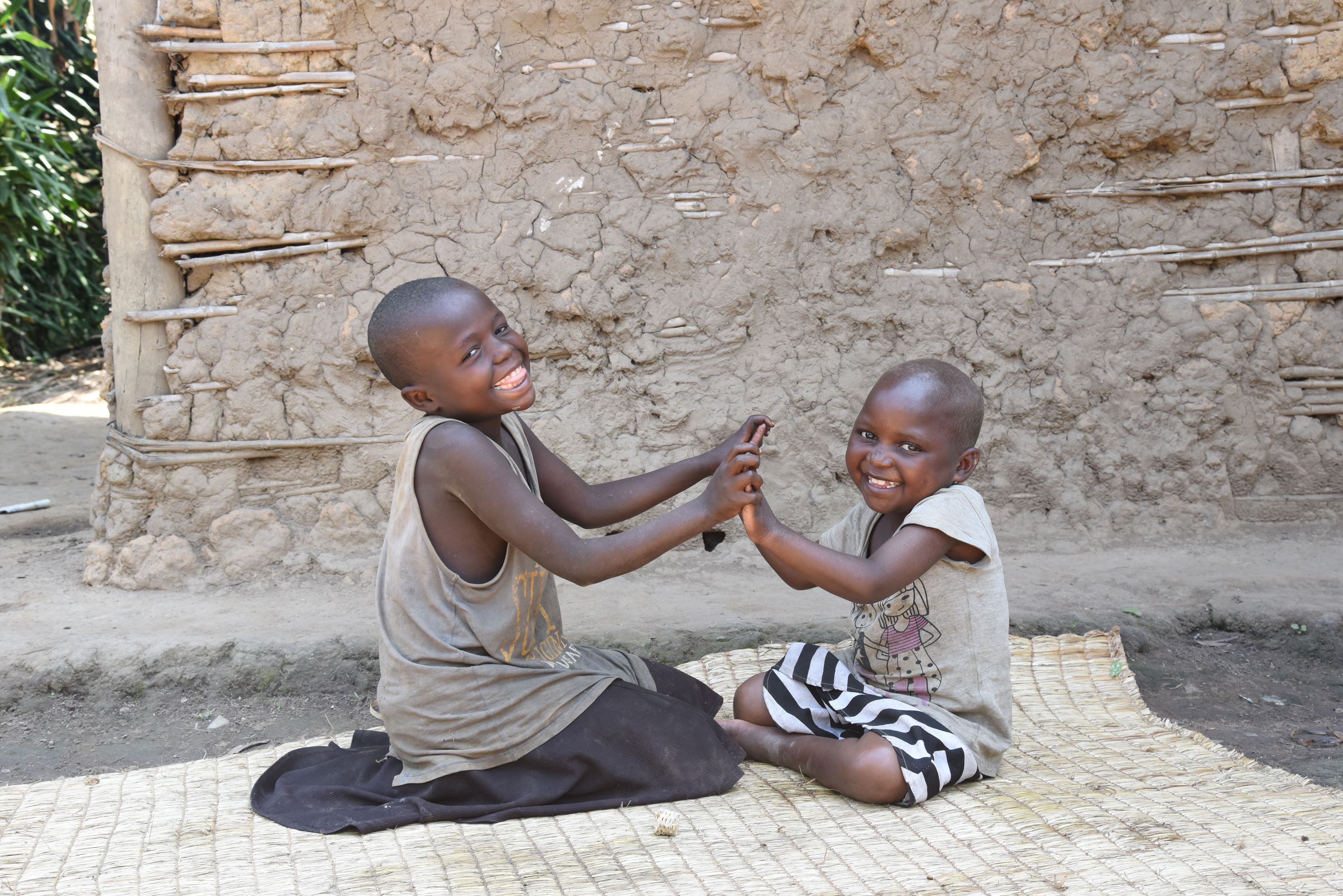 Happy and healthy, Jusline playing with her friend