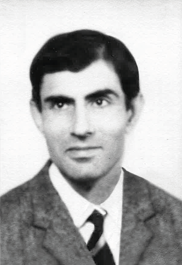 Black and white photo of a man wearing a suit and tie