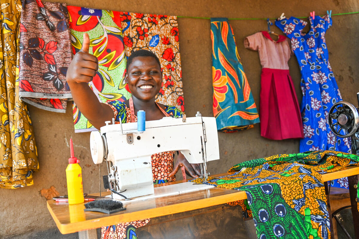 Entrepreneur sits in front of her sewing machine