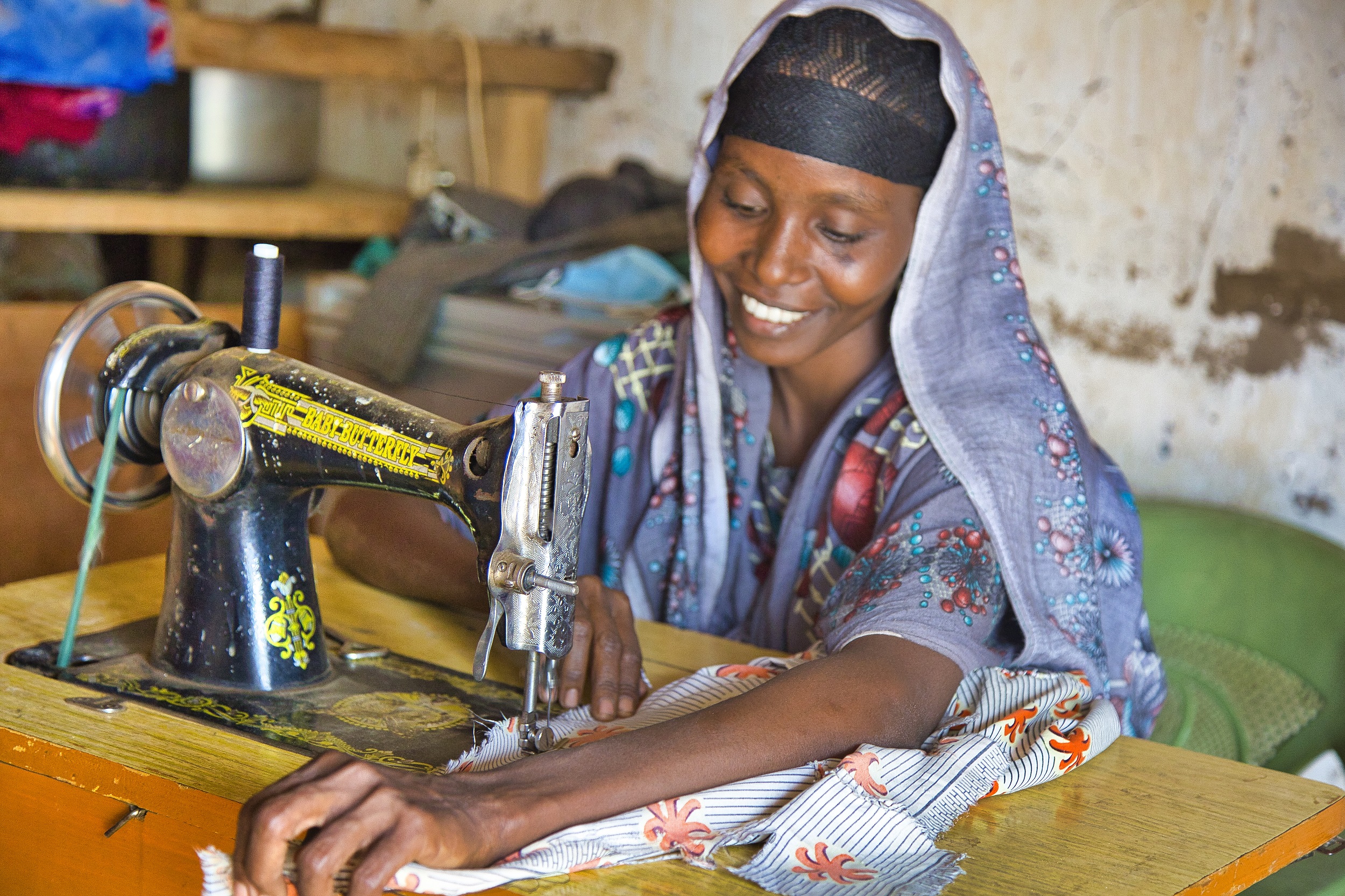 Muslima sewing with her machine 