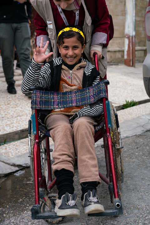 Girl sitting in the wheel chair