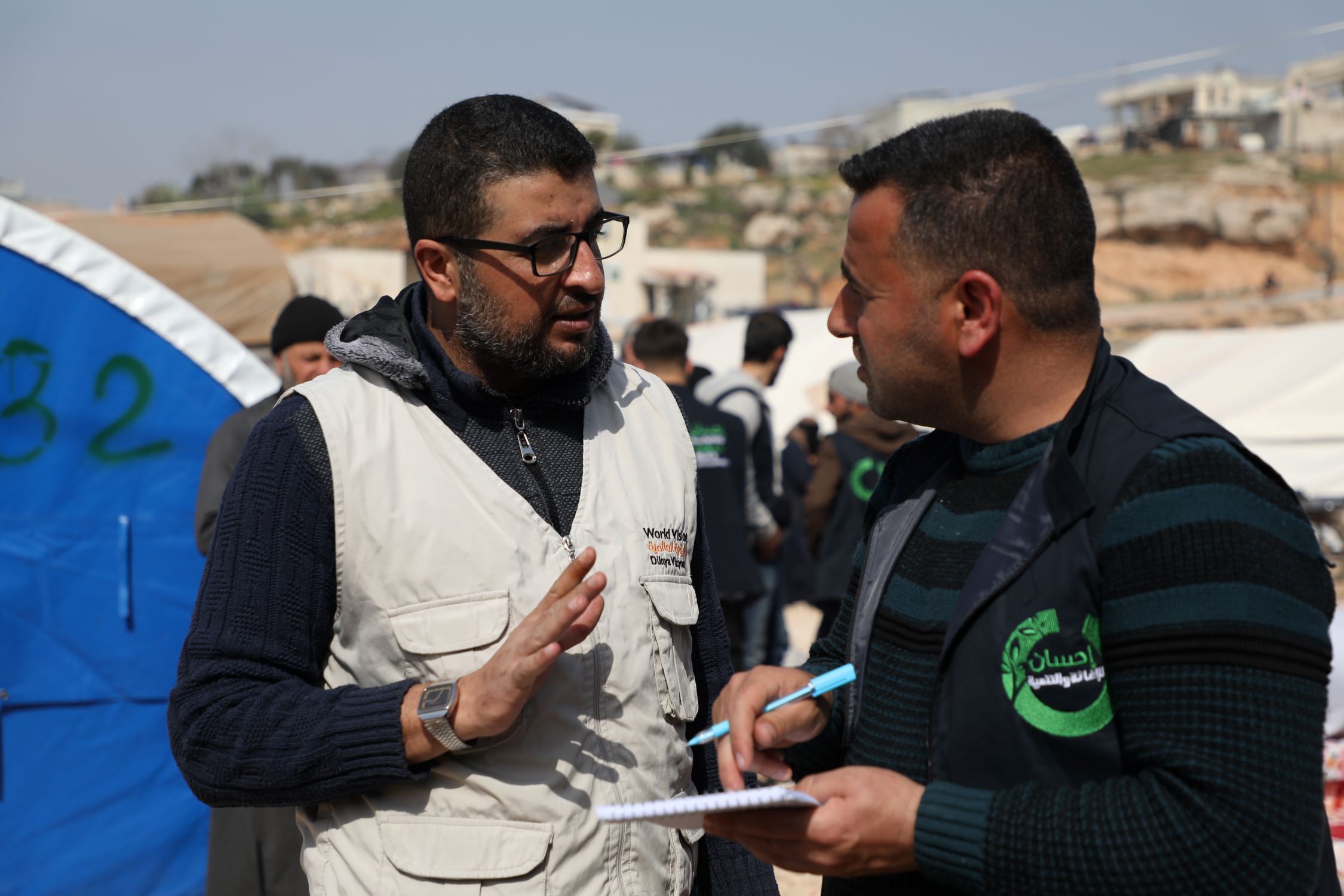 Two people talking in the aftermath of the Turkey Syria earthquakes