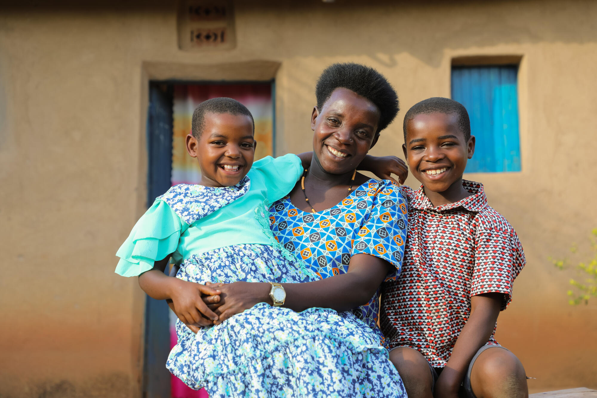 Victor, a sponsored child, with his sister and mother